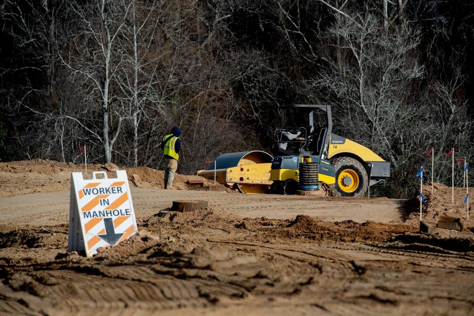 A construction crew work on a subdivision job site in West Asheville in this file photo. Just about all fields have high demand for workers in the mountains.