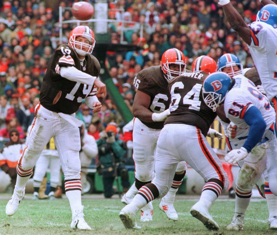 Browns quarterback Bernie Kosar passes the ball against the Denver Broncos Nov. 7, 1993, at Cleveland Municipal Stadium.