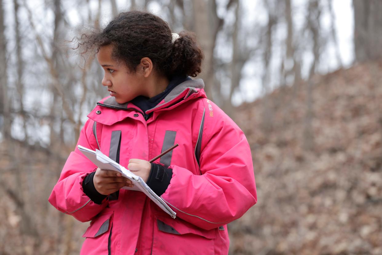 Fox River Academy student Skyler Ayres, 11, participates in an observation activity March 14 at Pierce Park in Appleton.