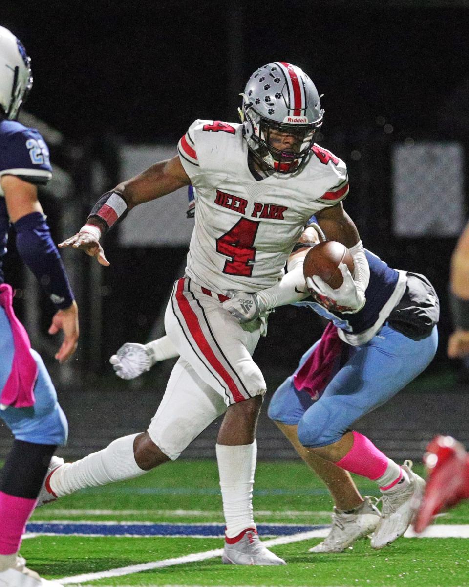 Deer Park wide receiver Norey Johnson (4) runs the ball in the game between Deer Park and CCD High School Oct. 30, 2021.