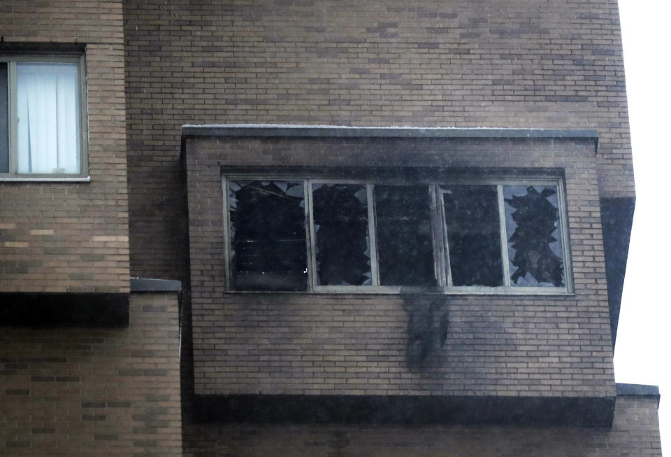 Broken windows and damage remain after a deadly fire at the high-rise apartment building Wednesday, Nov. 27, 2019, in Minneapolis. (David Joles/Star Tribune via AP)