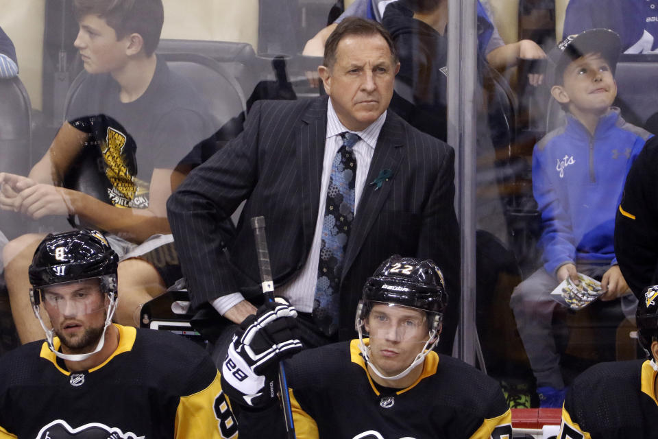 FILE - Pittsburgh Penguins assistant coach Jacques Martin stands behind his bench during an exhibition NHL hockey game against the Columbus Blue Jackets in Pittsburgh, Saturday, Sept. 30, 2017. The Ottawa Senators fired coach D.J. Smith on Monday, Dec. 18, 2023, replacing him on an interim basis with Jacques Martin. (AP Photo/Gene J. Puskar, File)