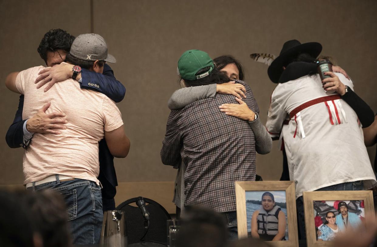 Family of the victims of a series of stabbings on the James Smith Cree Nation reserve in Saskatchewan hug following a news conference in Saskatoon on Sept. 7 (AP Photo/Robert Bumsted)