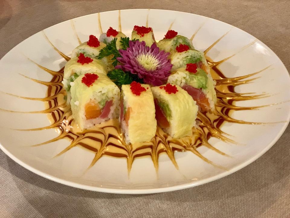 The signature Hana Moon roll is a work of art. Soy paper instead of seaweed embraces a medley of tuna, salmon, yellowtail, cucumber and avocado that’s topped with red tobiko.