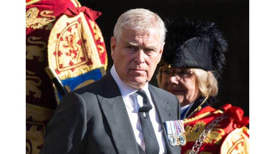 Prince Andrew wearing a charcoal suit 