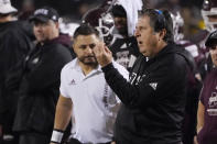 Mississippi State coach Mike Leach gestures to players during an NCAA college football game against Mississippi, Thursday, Nov. 25, 2021, in Starkville, Miss. Mississippi won 31-21. (AP Photo/Rogelio V. Solis)