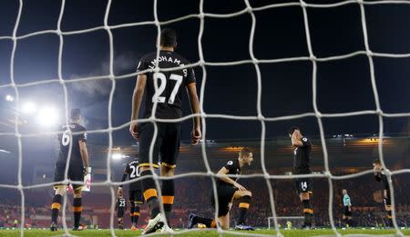 Britain Football Soccer - Middlesbrough v Hull City - Premier League - The Riverside Stadium - 5/12/16 Hull City's Michael Dawson and Ahmed Elmohamady look dejected with teammates after Middlesbrough's first goal Action Images via Reuters / Lee Smith Livepic