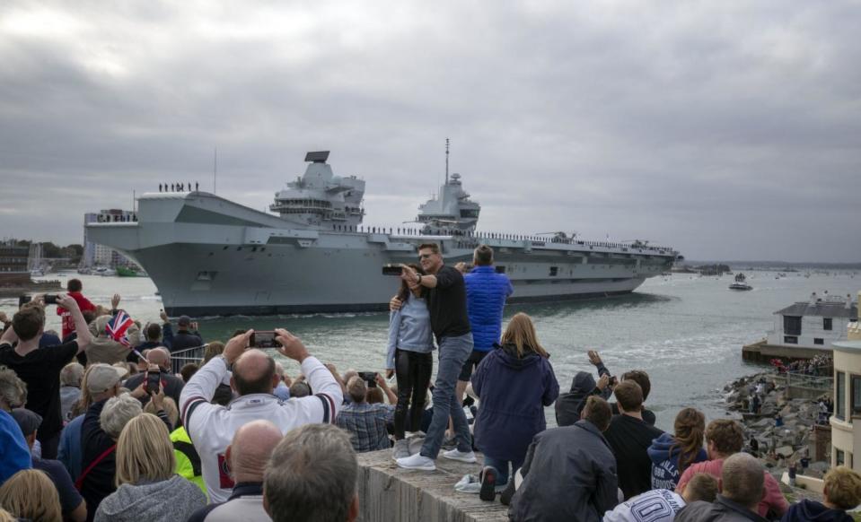 Large crowds gathered in Portsmouth to watch the ship depart on Saturday evening(PA)