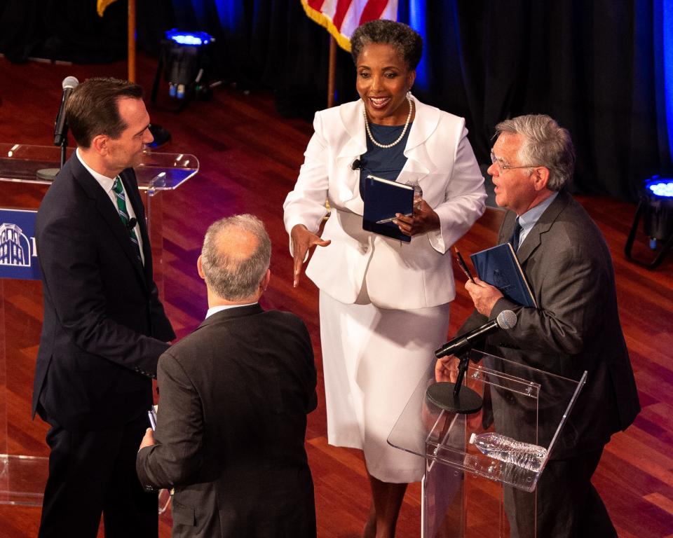 From left, State Rep. John Ray Clemmons, Mayor David Briley, retired Vanderbilt professor Carol Swain, and at-large Council member John Cooper greet each other after a mayoral debate at Belmont University's McAfee Concert Hall in Nashville, Tenn., Tuesday, June 25, 2019.