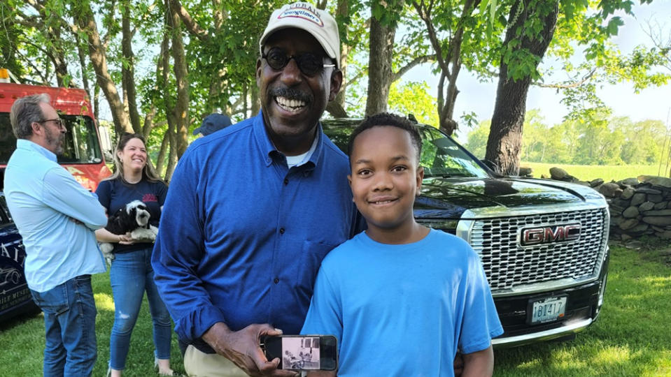 Donald Osborne, CEO of the Audrain Auto Museum and the Audrain Newport Concours & Motor Week, with 10-year-old automotive enthusiast Kyrie Hosier.