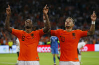 Netherland's scorer Georginio Wijnaldum, left, celebrates after he scored his side's third goal with Netherland's second scorer Memphis Depay, right, during the UEFA Nations League soccer match between The Netherlands and Germany at the Johan Cruyff ArenA in Amsterdam, Saturday, Oct. 13, 2018. The Netherlands defeated Germany with 3-0. (AP Photo/Peter Dejong)