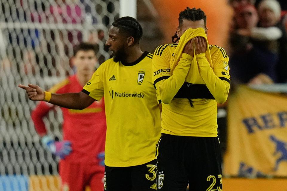 Dec 2, 2023; Cincinnati, Ohio, USA; Columbus Crew defender Mohamed Farsi (23) and defender Steven Moreira (31) react to a goal by FC Cincinnati midfielder Luciano Acosta (10) during the first half of the MLS Cup Eastern Conference Finals at TQL Stadium.