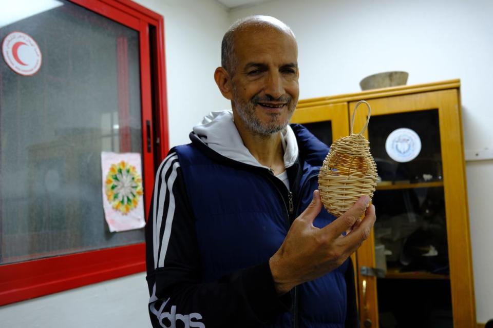 <div class="inline-image__caption"><p>Zaki Abu Jamus hand-weaves a delicate birdhouse.</p></div> <div class="inline-image__credit">Marta Vidal</div>