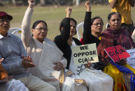 Retired college teachers participate in a protest against the Citizenship Amendment Act in Gauhati, India, Friday, Dec. 27, 2019. Tens of thousands of protesters have taken to India's streets to call for the revocation of the law, which critics say is the latest effort by Narendra Modi's government to marginalize the country's 200 million Muslims. (AP Photo/Anupam Nath)