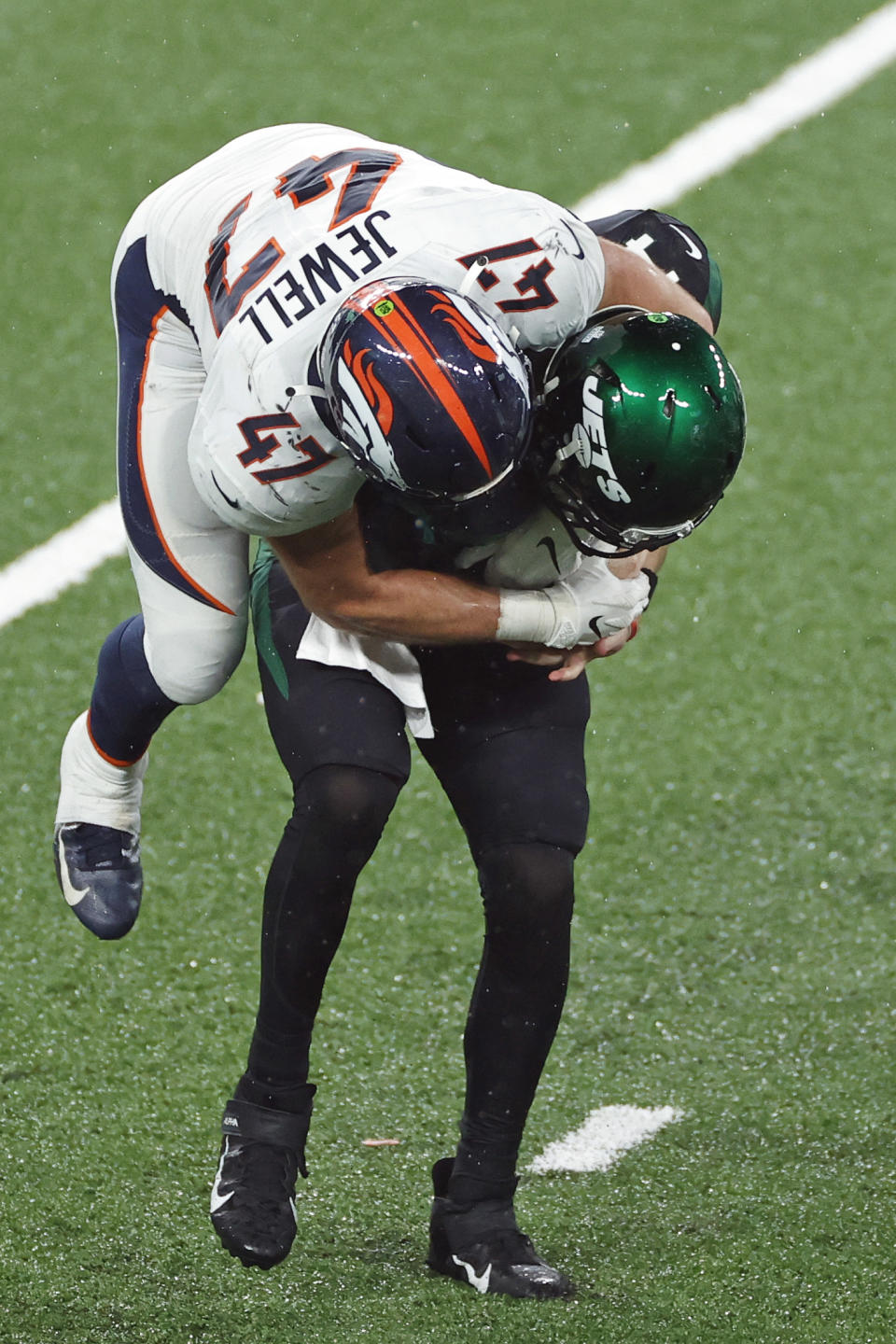 Denver Broncos inside linebacker Josey Jewell (47) sacks New York Jets quarterback Sam Darnold (14) during an NFL football game, Thursday, Oct. 1, 2020, in East Rutherford, N.J. The New York Jets and Giants are both 0-4 for the first time since 1976, and victories might be tough to come by this season. That has left the fans of both teams frustrated, disgusted and already looking to next season just four games into this season. (AP Photo/Adam Hunger, File)