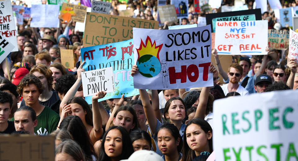 Protesters with placards participate in The Global Strike 4 Climate rally in Sydney on Friday. Source: AAP