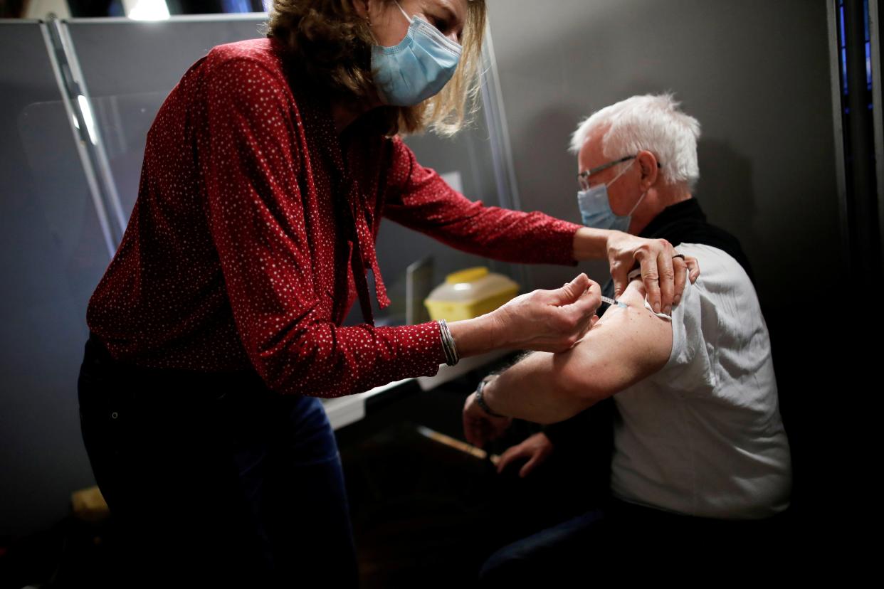 <p>A senior citizen receiving the Pfizer-BioNTech vaccine in Paris earlier this month</p> (Reuters)