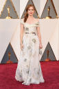 Isla Fischer looks ethereal as she takes to the red carpet in an off-shoulder egg-shell white dress.