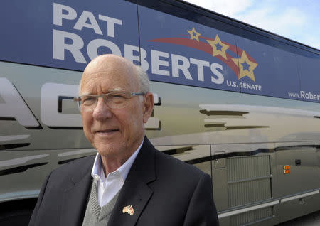 Republican U.S. Senator Pat Roberts stands outside his campaign bus after a rally in Paola, Kansas October 11, 2014. REUTERS/Dave Kaup