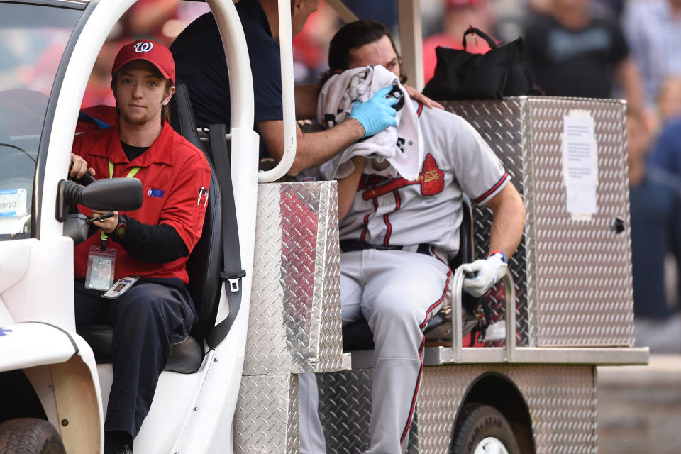 Charlie Culberson of the Atlanta Braves is taken off the field after getting hit by a pitch in the seventh inning. (Photo by Mitchell Layton/Getty Images)