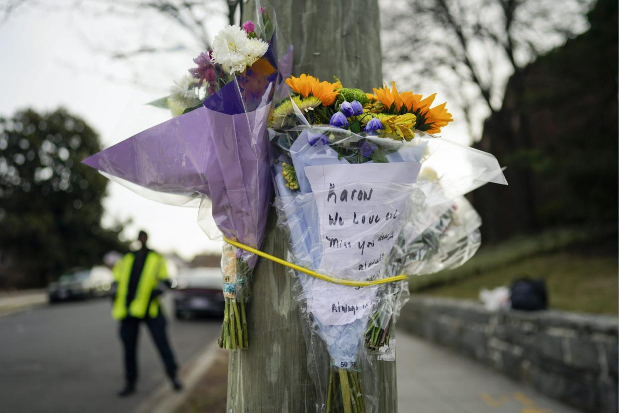 Flowers are secured to a pole as a memorial to Karon Blake, 13, on the corner of Quincy Street NE and Michigan Avenue NE in the Brookland neighborhood of Washington, Jan. 10, 2023. (AP Photo/Carolyn Kaster, File)