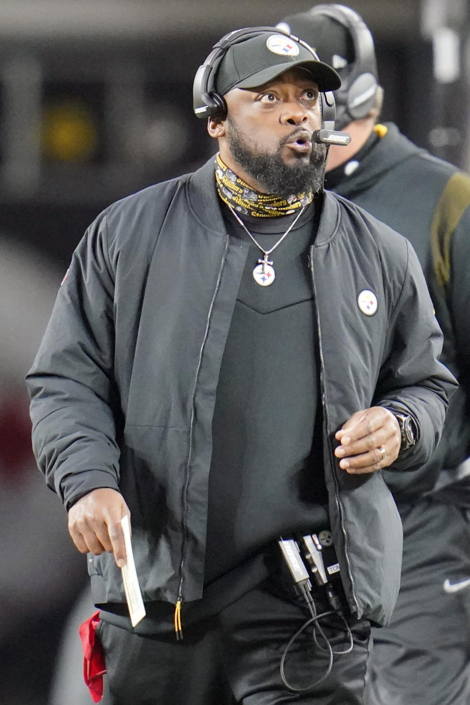 Pittsburgh Steelers head coach Mike Tomlin looks up at the videoboards he walks the sideline during the first half of an NFL football game against the Baltimore Ravens, Sunday, Dec. 5, 2021, in Pittsburgh. (AP Photo/Gene J. Puskar)