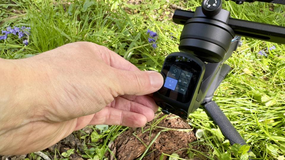 Close up of a hand using a FeiyuTech Scorp 2 gimbal