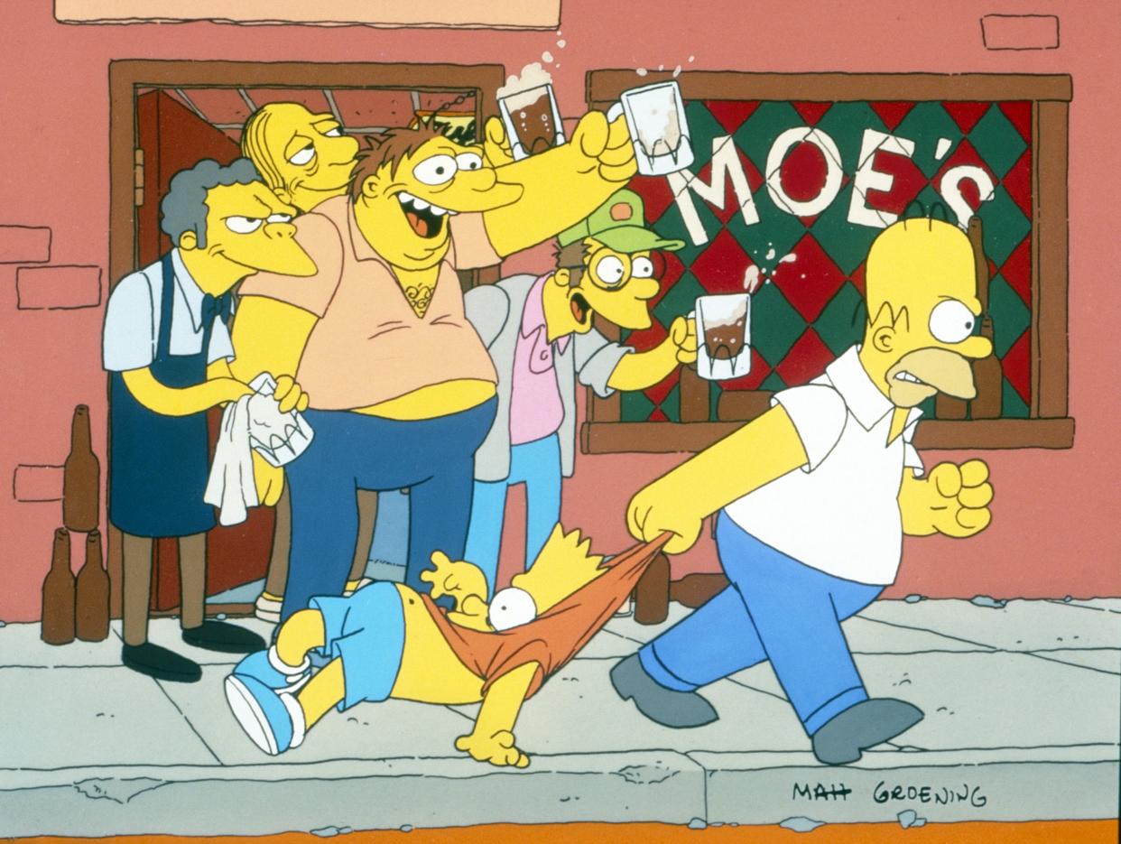 The guys from Moe's Tavern, with Larry the Barfly in the back in the doorframe.