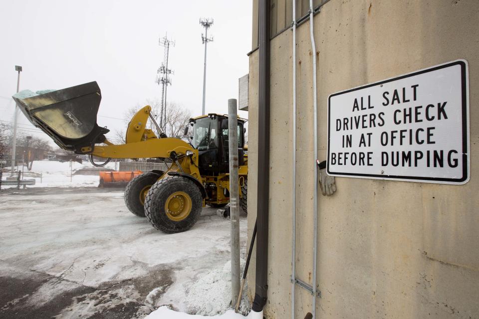 Road salt is unloaded from storage at the public works facility in Glen Ellyn, Ill., on Tuesday, Feb. 4, 2014. The Midwest's recent severe winter weather has caused communities to expend large amounts of their road salt supplies. (AP Photo/Andrew A. Nelles)