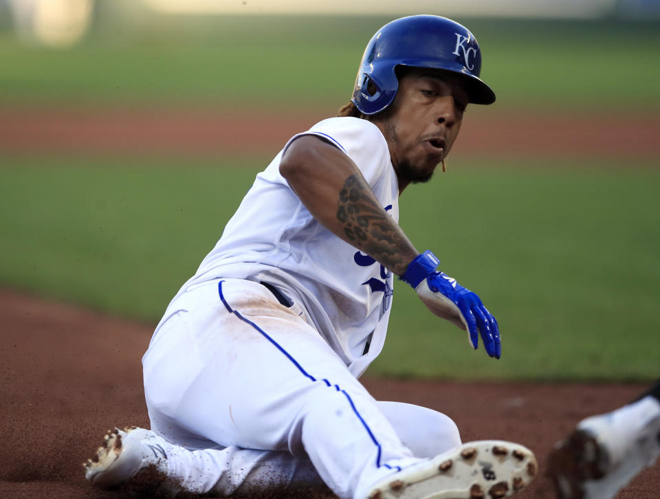 Kansas City Royals' Adalberto Mondesi steals third base during the first inning of a baseball game against the Chicago White Sox at Kauffman Stadium in Kansas City, Mo., Tuesday, July 16, 2019. Mondesi scored on the play. Chicago White Sox third baseman Yoan Moncada was charged with an error. (AP Photo/Orlin Wagner)