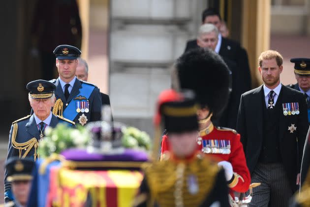 Prince William and Prince Harry walk behind the coffin of Queen Elizabeth II, adorned with a Royal Standard and the Imperial State Crown and pulled by a Gun Carriage of The King's Troop Royal Horse Artillery. (Photo: DANIEL LEAL via Getty Images)