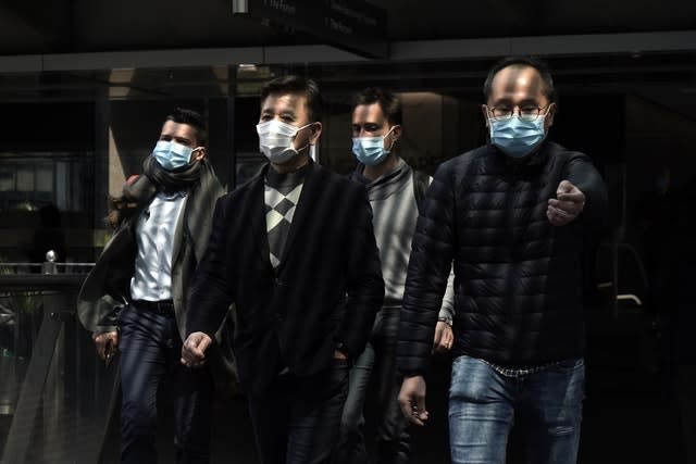 People wearing face masks in a business district in Hong Kong