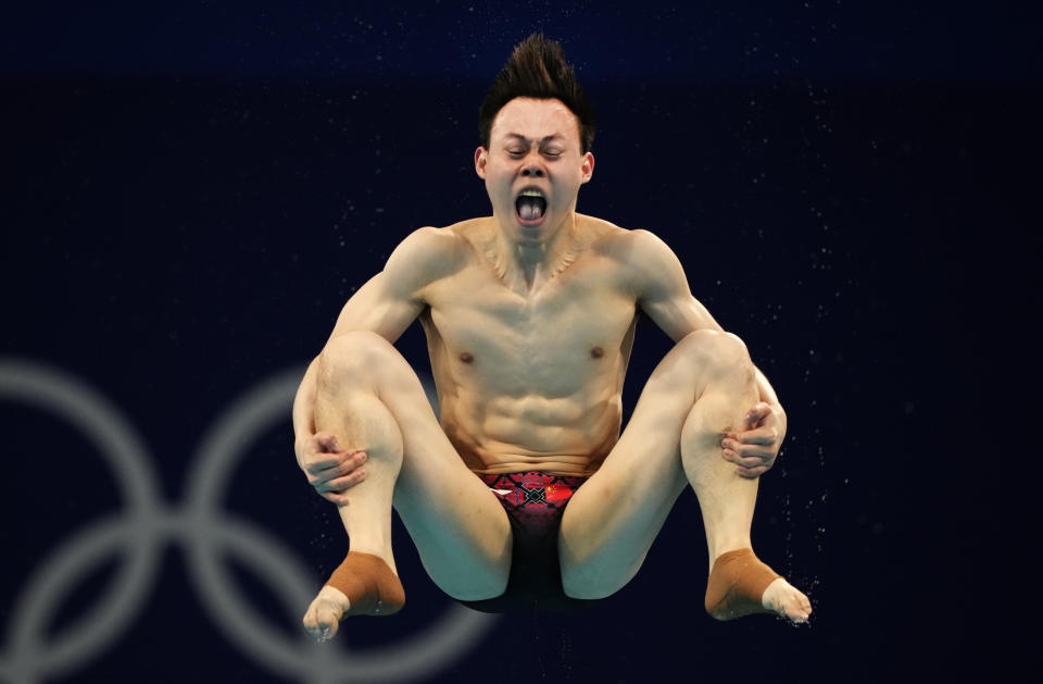 Xie Siyi of China competes in men's diving 3m springboard preliminary at the Tokyo Aquatics Centre at the 2020 Summer Olympics, Monday, Aug. 2, 2021, in Tokyo, Japan. (AP Photo/Dmitri Lovetsky)