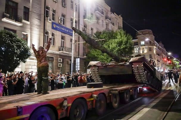 PHOTO: Members of the Wagner Group military company load their tank onto a truck on a street in Rostov-on-Don, Russia, June 24, 2023, prior to leaving an area at the headquarters of the Southern Military District. (AP)