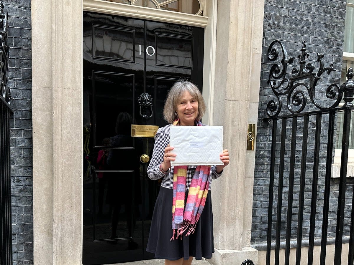 Dr Susan Michaelis delivering a petition to 10 Downing Street  (Supplied)