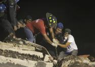 <p>CORRECTS NEIGHBORHOOD – Rescue workers and volunteers search a building that collapsed after an earthquake, in the Colonia Obrera neighborhood of Mexico City, Tuesday, Sept. 19, 2017. A magnitude 7.1 earthquake has stunned central Mexico, killing at least more than 100 people as buildings collapsed in plumes of dust. Thousands fled into the streets in panic, and many stayed to help rescue those trapped. (AP Photo/Miguel Tovar) </p>