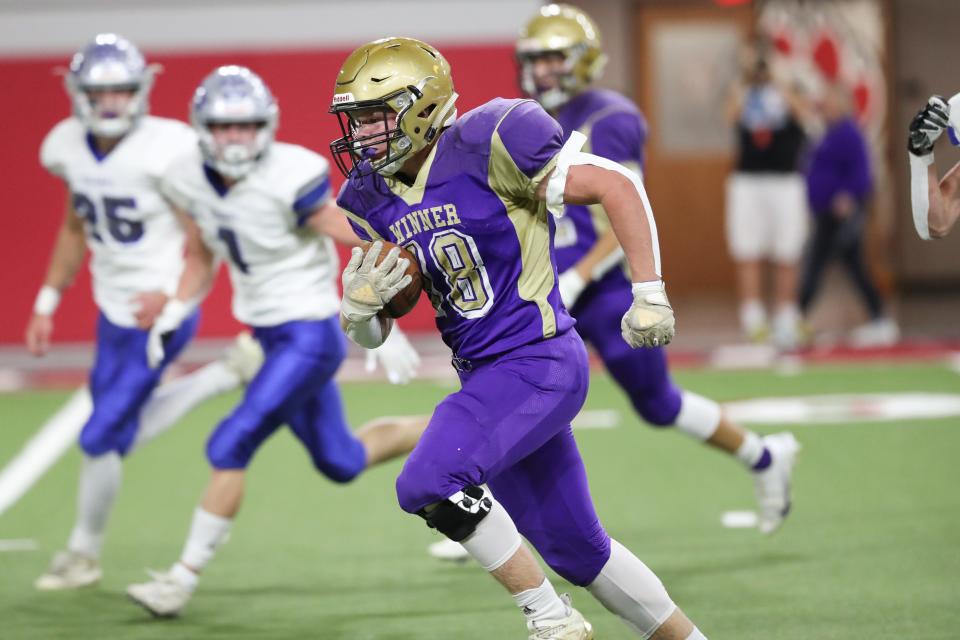 Winner FB Aiden Barfuss (18) rushes for the second score of the game against the Bridgewater-Emery/Ethan Seahawks during the 11B State Championship game in the Dakota Dome.  Winner won 40-8.