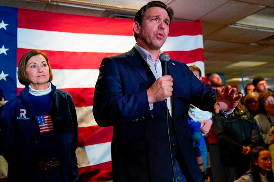 PHOTO: Republican presidential candidate Florida Gov. Ron DeSantis, right, speaking at an event in West Des Moines, Iowa, Jan. 13, 2024. (Pablo Martinez Monsivais/AP)