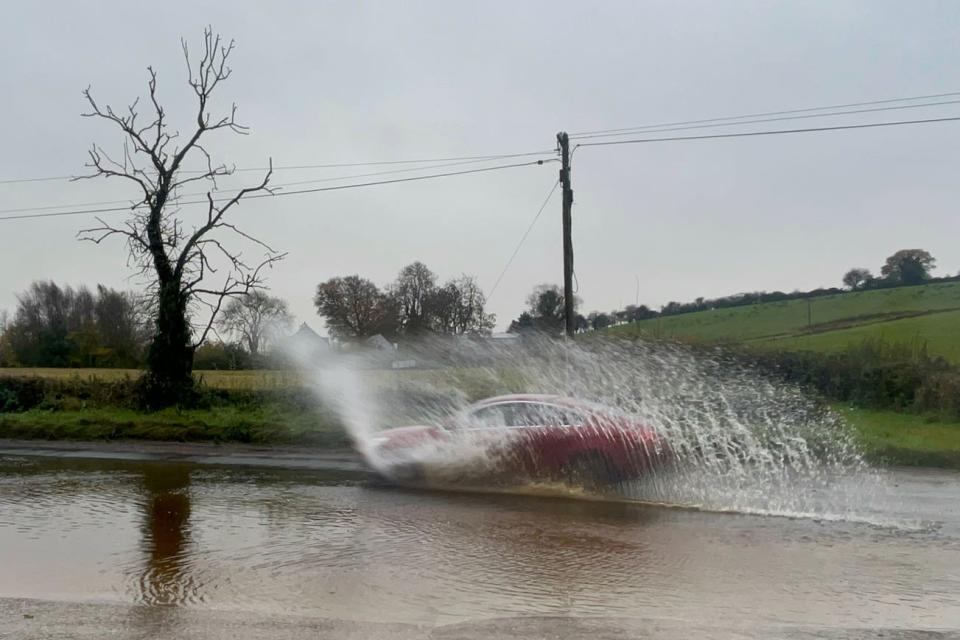 Cars struggled through flood water on roads surrounding Cookstown in Co Tyrone (Claudia Savage/PA) (PA Wire)