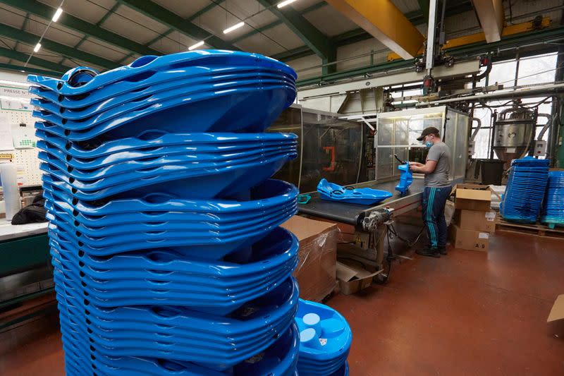 A staff member assembles products at world biggest snowshoes maker TSL in Annecy