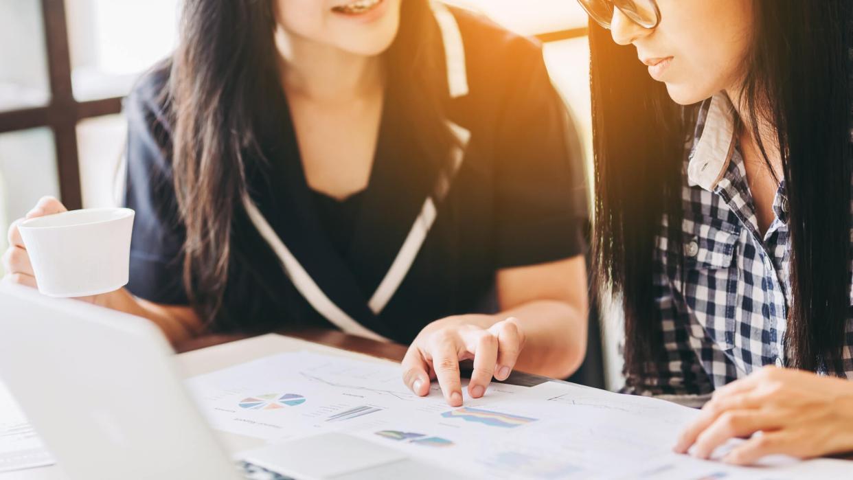 two women reviewing financial documents