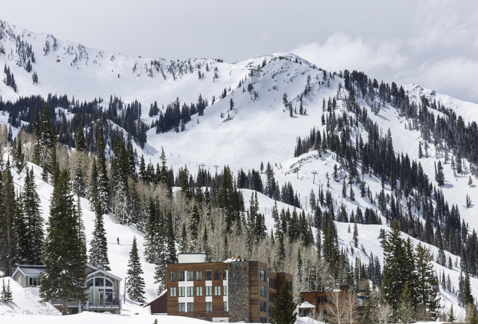 The town of Alta, Utah, sits below Snowbird in Little Cottonwood Canyon, Thursday, May 9, 2024. Rescue crews were searching for three skiers following an avalanche Thursday in the mountains outside of Salt Lake City that occurred after several days of spring snowstorms, authorities said. . (Isaac Hale/The Deseret News via AP)