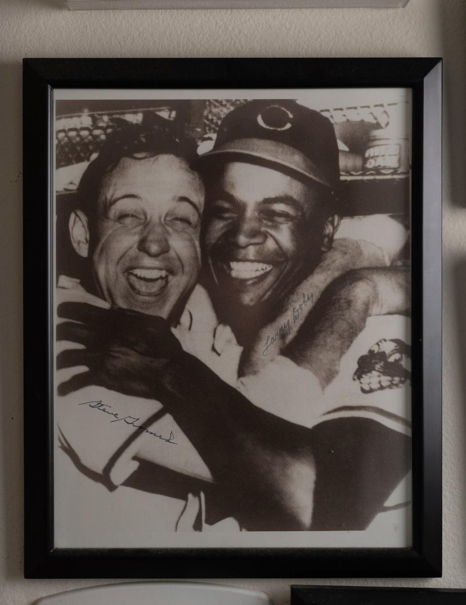 A photo of Cleveland Indians players Larry Doby, right, and Steve Gromek from the 1948 World Series following Doby's deciding home run is posted on a wall at the home of Gormek's son, Gregory Gromek, in Beverly Hills on Wednesday, March 13, 2024.