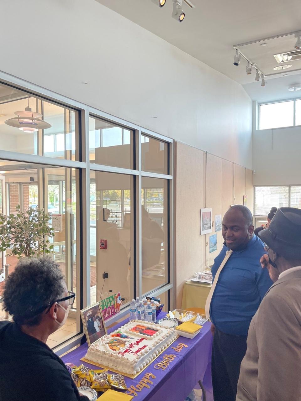 Artist Jonathan Wynn (far right) is shown next to his father Gordon Wynn at the Willingboro Public Library on his birthday. He had an art exhibit at the library on the big day, which was Oct. 28.