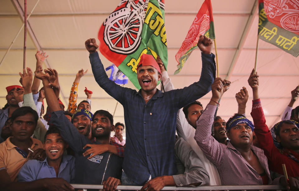 Supporters of Bahujan Samaj Party (BSP), Samajwadi Party (SP) and Rashtriya Lok Dal (RLD) shout slogans during an election rally in Deoband, Uttar Pradesh, India, Sunday, April 7, 2019. Political archrivals in India's most populous state rallied together Sunday, asking voters to support a new alliance created with the express purpose of defeating Prime Minister Narendra Modi's ruling Hindu nationalist Bharatiya Janata Party. (AP Photo/Altaf Qadri)