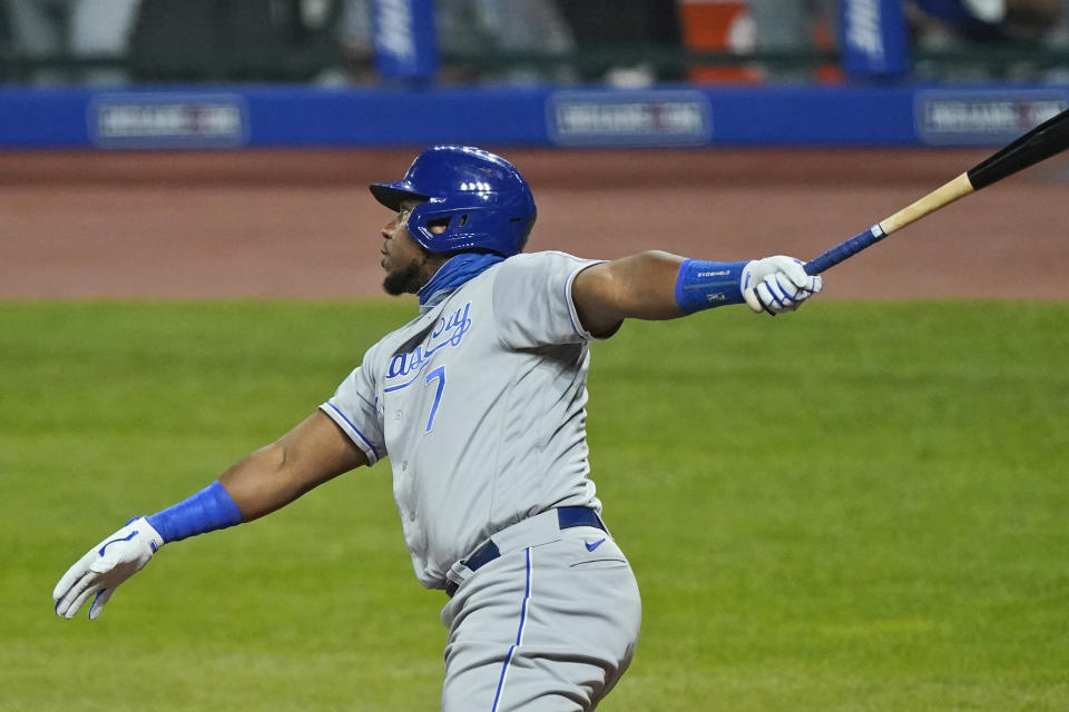 Kansas City Royals' Maikel Franco watches his RBI sacrifice fly during the eighth inning of the team's baseball game against the Cleveland Indians, Tuesday, Sept. 8, 2020, in Cleveland. (AP Photo/Tony Dejak)