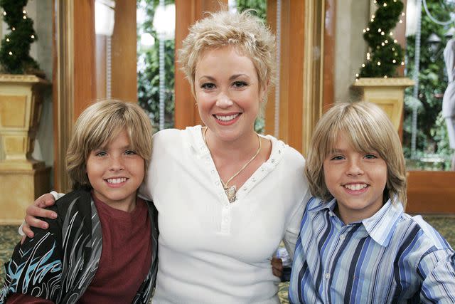<p>It's A Laugh Productions/Walt Disney Tv/Kobal/Shutterstock</p> 'The Suite Life of Zack & Cody' stars Dylan and Cole Sprouse pose with their on-screen mom, Kim Rhodes