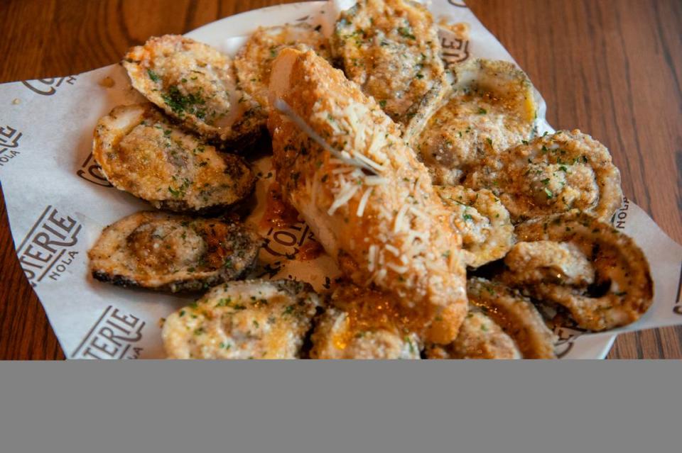 The chargrilled oysters, topped with a special blend of cheese and served with bread slices at Coterie Restaurant and Oyster Bar in Long Beach, which brings the tastes of New Orleans to the Coast. Hannah Ruhoff/Sun Herald