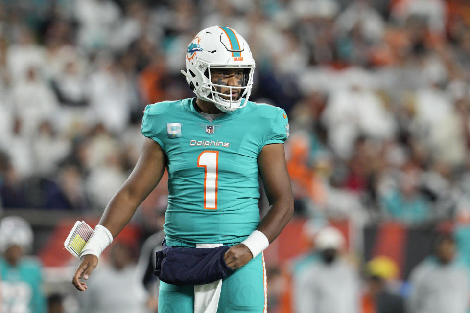 Miami Dolphins quarterback Tua Tagovailoa looks to the sidelines during the first half of an NFL football game against the Cincinnati Bengals, Thursday, Sept. 29, 2022, in Cincinnati. Tagovailoa suffered a second frightening injury in five days when he was carted off the field Thursday. (AP Photo/Jeff Dean)