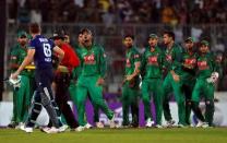 Cricket - England v Bangladesh - Second One Day International - Sher-e-Bangla Stadium, Dhaka, Bangladesh - 09/10/16. Bangladesh players exchange words with England's Jos Buttler after he was bowled out during the second One Day International. REUTERS/Cathal McNaughton